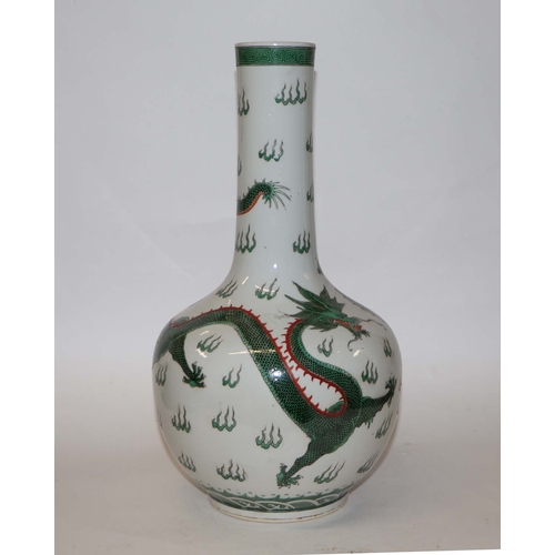 761 - A Chinese famille verte bottle vase decorated with dragons chasing a flaming pearl, blue character m... 