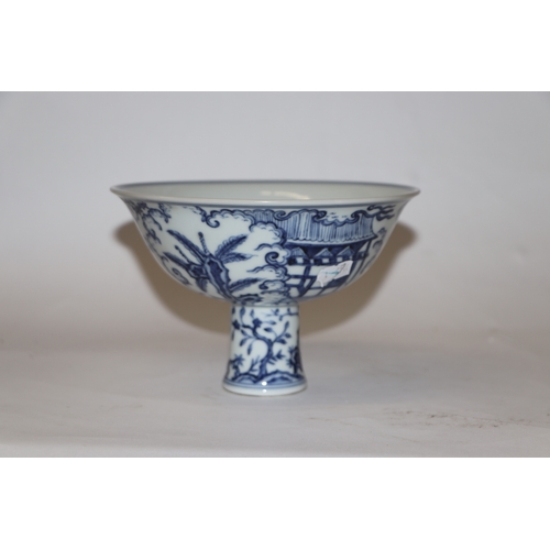 807 - A Chinese blue and white stem cup decorated with figures within a garden scene, 17cm diameter