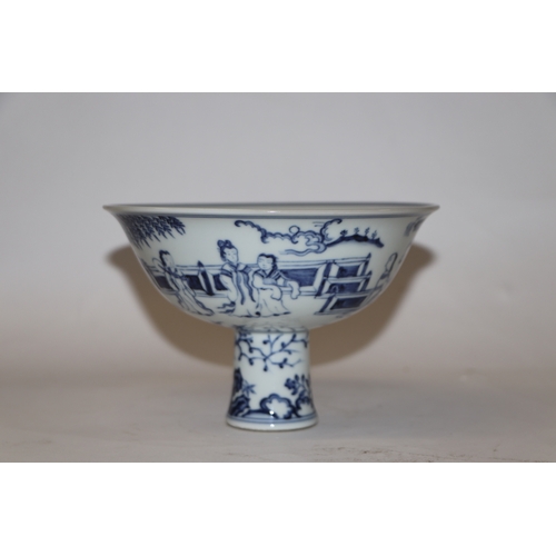 807 - A Chinese blue and white stem cup decorated with figures within a garden scene, 17cm diameter