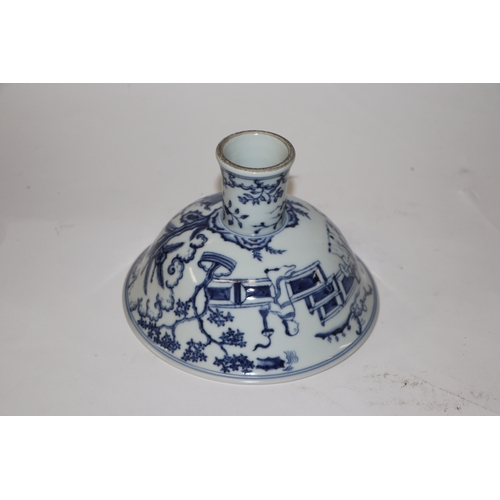 807 - A Chinese blue and white stem cup decorated with figures within a garden scene, 17cm diameter