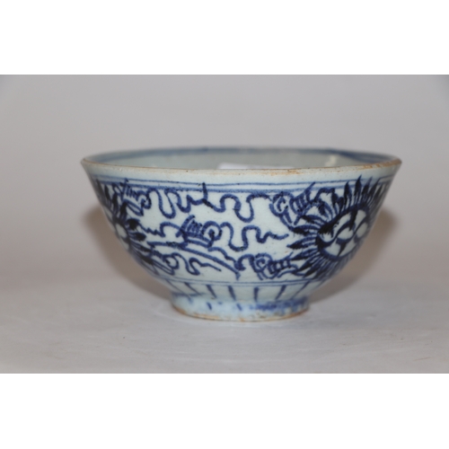 892 - A Chinese blue and white footed bowl decorated with dragons amongst clouds with six character blue m... 