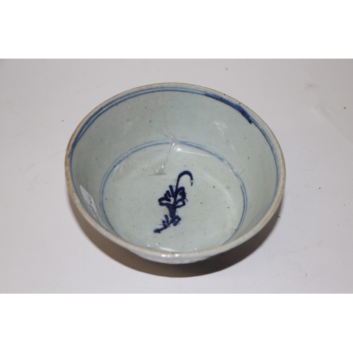 892 - A Chinese blue and white footed bowl decorated with dragons amongst clouds with six character blue m... 