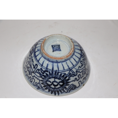 892 - A Chinese blue and white footed bowl decorated with dragons amongst clouds with six character blue m... 