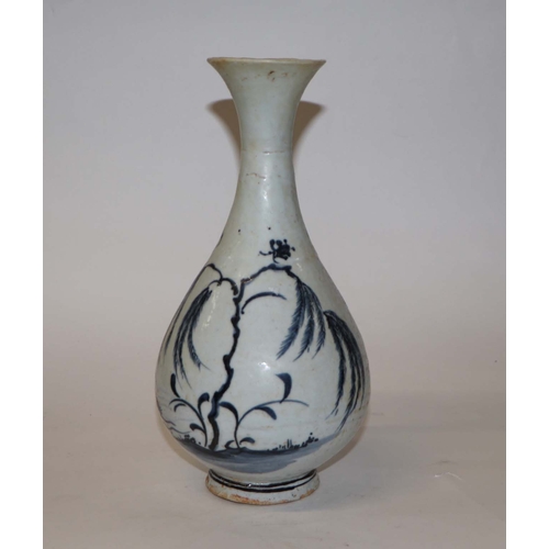 908 - A Chinese blue and white bottle vase decorated with birds and foliage, 25cm high.