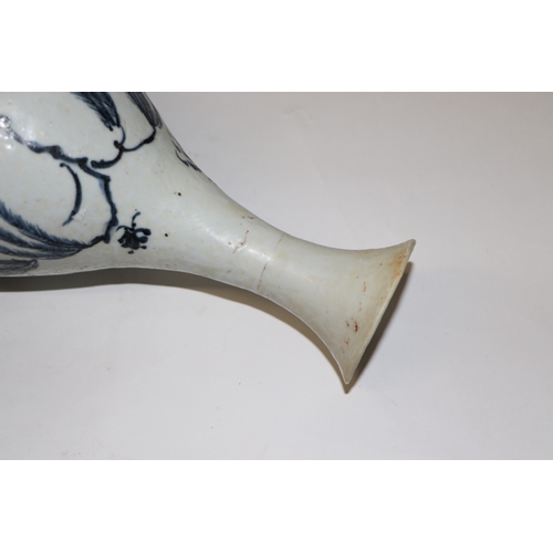 908 - A Chinese blue and white bottle vase decorated with birds and foliage, 25cm high.