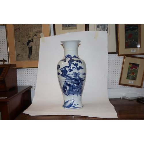 891 - A large Chinese blue and white baluster vase decorated with figures in a landscape, 46cm high.