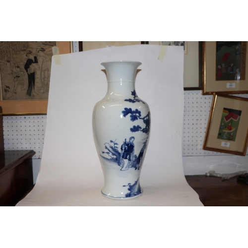 891 - A large Chinese blue and white baluster vase decorated with figures in a landscape, 46cm high.