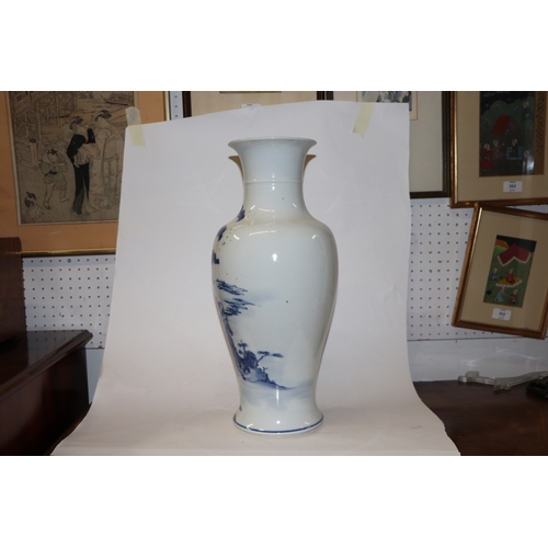 891 - A large Chinese blue and white baluster vase decorated with figures in a landscape, 46cm high.