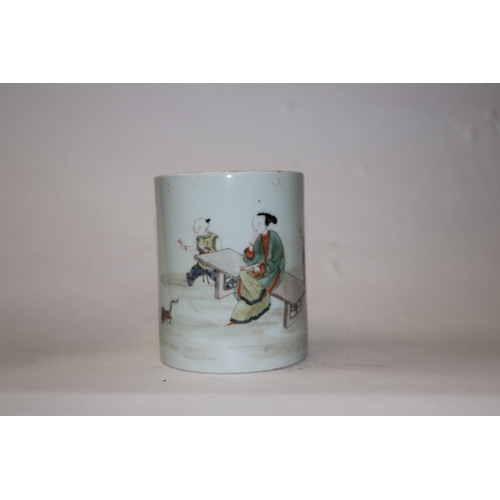 896 - A Chinese famille rose Bitong brush pot decorated with boys playing and a robed female seated on a b... 