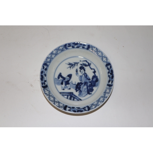 883 - A pair of Chinese blue and white dishes decorated with figures in a garden, four character blue mark... 