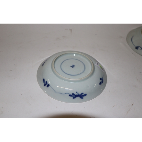 883 - A pair of Chinese blue and white dishes decorated with figures in a garden, four character blue mark... 