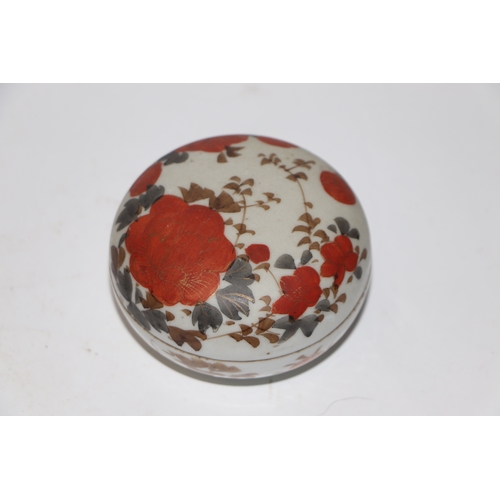 865 - A Chinese famille rose paste box of compressed circular form decorated with young boys playing on a ... 