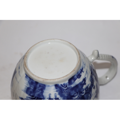 887 - A Chinese blue and white teapot decorated with a river landscape scene, 15cm high.