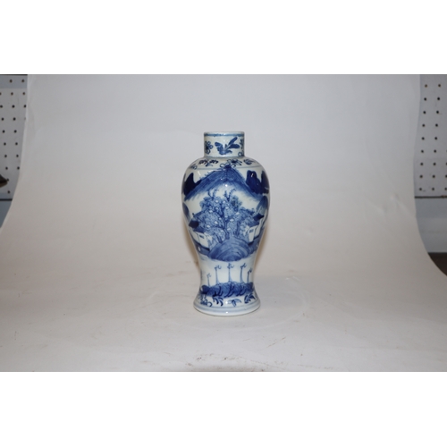 796 - A Chinese blue & white baluster vase decorated in relief with a landscape, four character mark to th... 