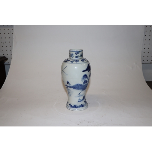 796 - A Chinese blue & white baluster vase decorated in relief with a landscape, four character mark to th... 