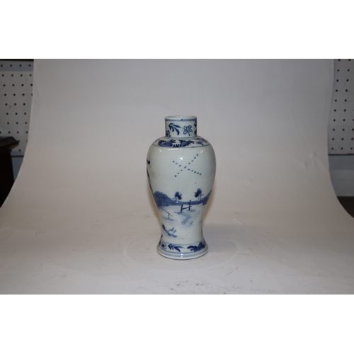 796 - A Chinese blue & white baluster vase decorated in relief with a landscape, four character mark to th... 