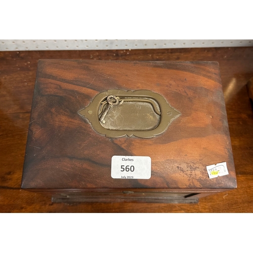 560 - A Victorian figured walnut jewellery box, the lift-up lid enclosing a fitted interior with fall-flap... 