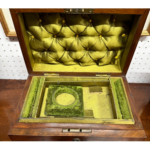 560 - A Victorian figured walnut jewellery box, the lift-up lid enclosing a fitted interior with fall-flap... 