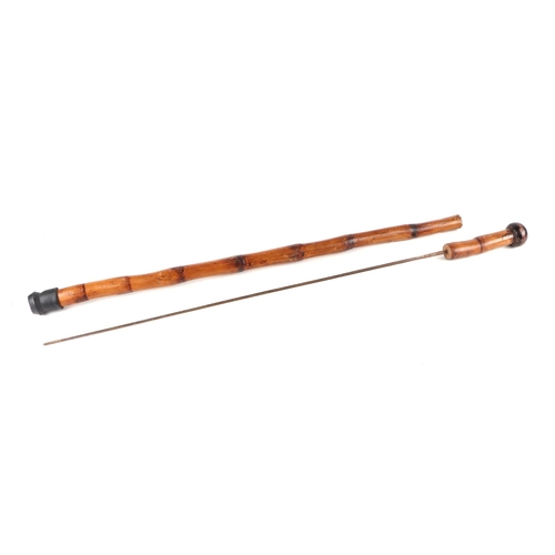 103 - A bamboo shafted Sword stick with square section tapering blade. Blade length 68.5cms (27ins) and an... 