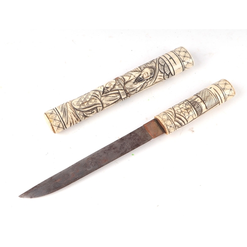 109 - A  late 19th century carved bone Japanese Tanto dagger with 17.5cms (6.875ins) blade.