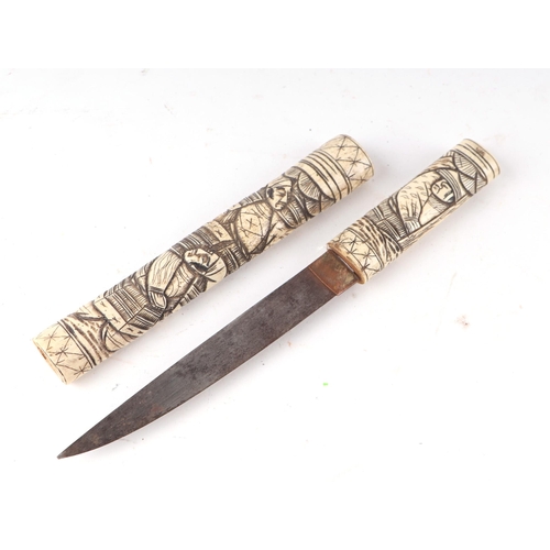 110 - A late 19th century carved bone Japanese Tanto dagger with 16cms (6.25ins) blade.