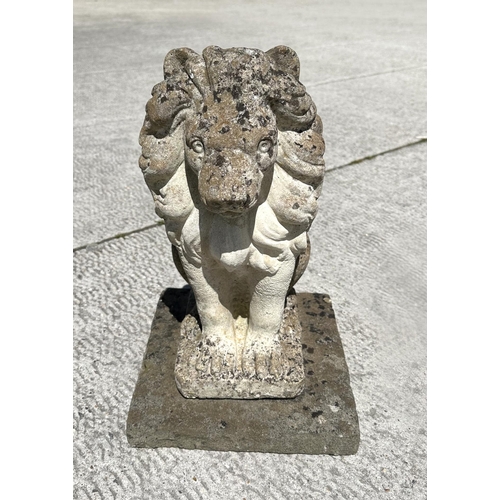 13 - A group of three reconstituted stone seated lions, 44cm high. (3)