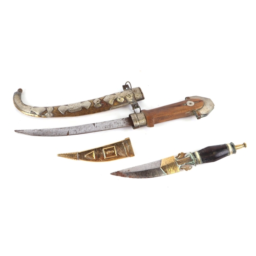 134 - A Spanish folding knife, 18cm long opened, two Middle Eastern daggers, together with a Solingen cut ... 