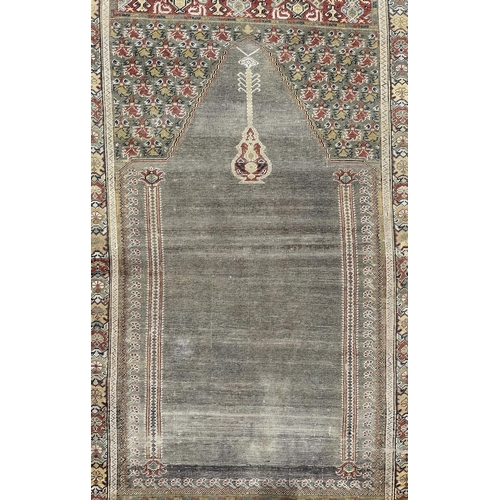 143 - A Turkish prayer rug on a pale blue ground and foliate borders, probably late 19th century, 103 by 1... 