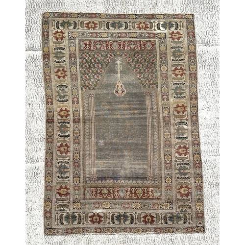 143 - A Turkish prayer rug on a pale blue ground and foliate borders, probably late 19th century, 103 by 1... 