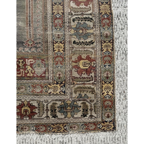 143 - A Turkish prayer rug on a pale blue ground and foliate borders, probably late 19th century, 103 by 1... 