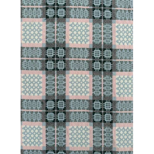 151 - A Welsh woollen blanket with geometric design on a blue ground, 154cm by 220cm.