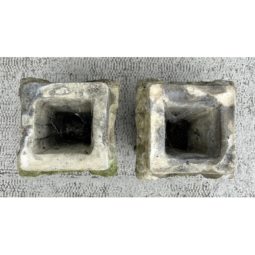 16 - A pair of well weathered reconstituted stone planters, 34cms wide by 34cms high (2).