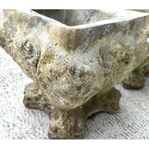 16 - A pair of well weathered reconstituted stone planters, 34cms wide by 34cms high (2).