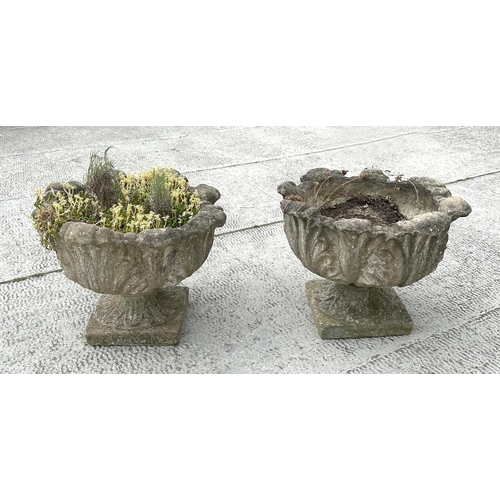 18 - A pair of well weathered reconstituted stone urn planters, 48cm diameter (2)