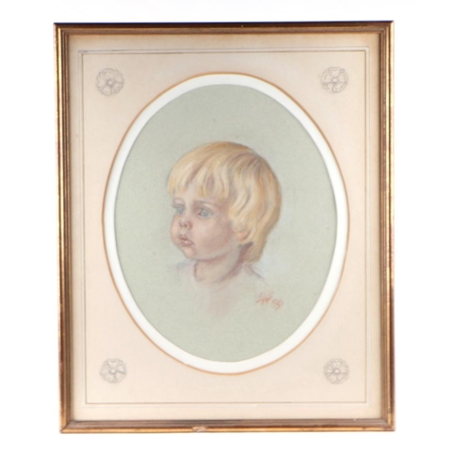 207 - 20th century British School - a pair of head & shoulder portraits depicting young boys, pastel, both... 