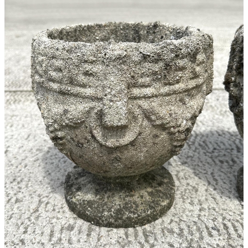 22 - A set of four well weathered reconstituted stone urn form planters, 23cm diameter, (4)