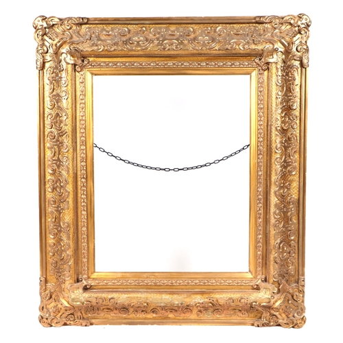 229 - A large 19th century gilt wood and gesso picture frame, overall 83cm by 96cm (to hold painting 58cm ... 