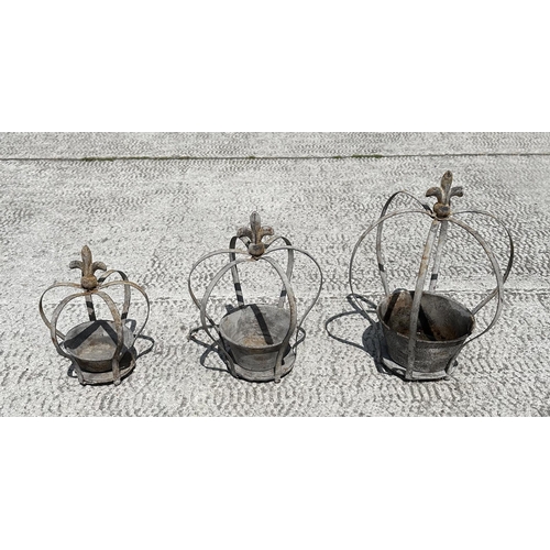 23 - A graduated set of galvanised crown form planters, largest 34cm high, (3)