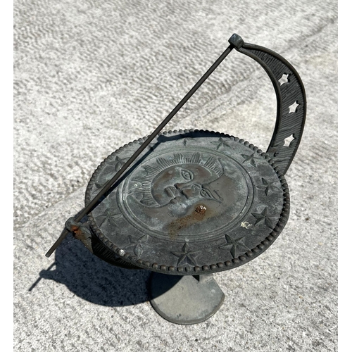 25 - A bronzed metal sun dial on stand, 23cm diameter.