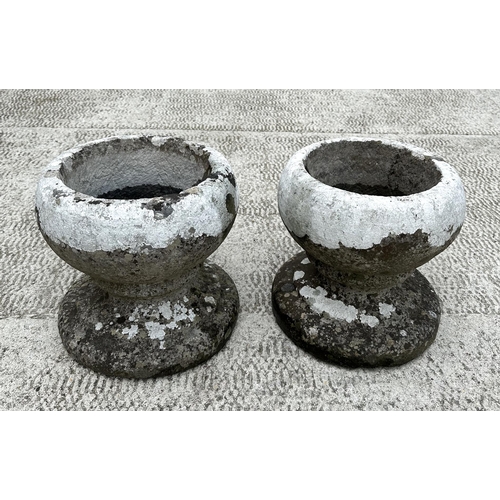 27 - A pair of stone planters, 31cms diameter.