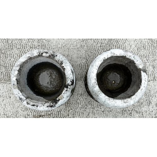 27 - A pair of stone planters, 31cms diameter.