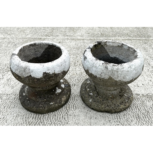 27 - A pair of stone planters, 31cms diameter.