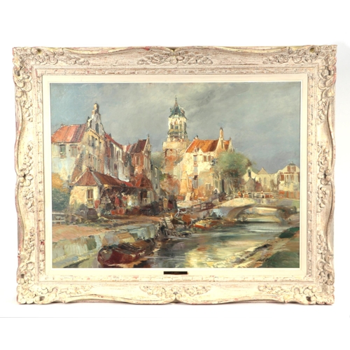 293 - Continental school - Town Scene with a Canal and Barges in the Foreground - indistinctly signed lowe... 