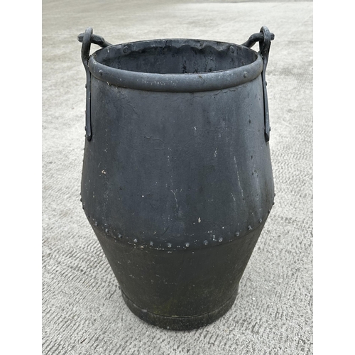 33 - A large riveted well bucket, 65cms high.