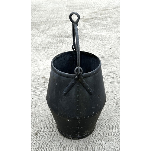 33 - A large riveted well bucket, 65cms high.