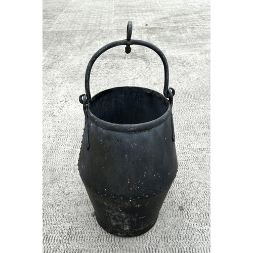 33 - A large riveted well bucket, 65cms high.