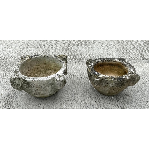 35 - A marble mortar, 30cms diameter; together with a reconstituted stone mortar, 33cms wide (2).