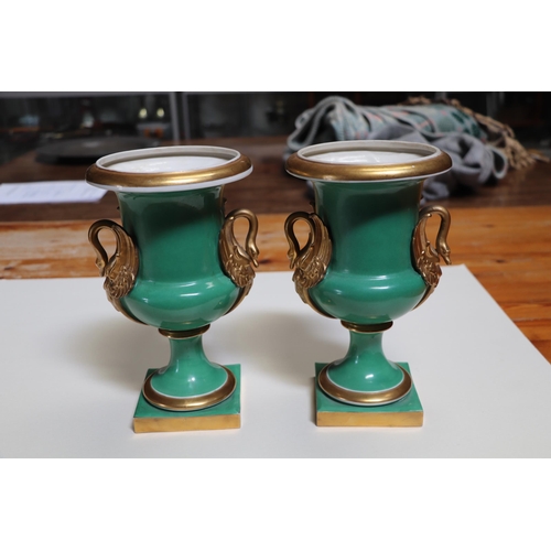 351 - A pair of 19th century continental vases with gilt swan form handles, 25cms high (2).