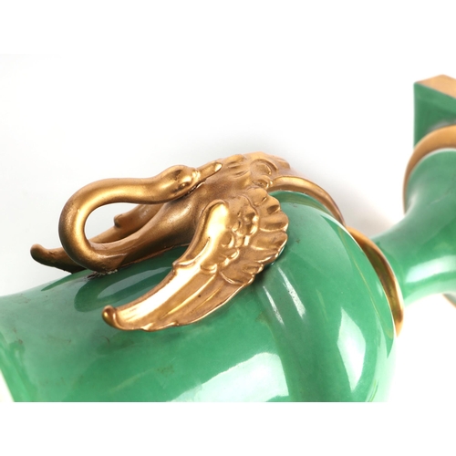 351 - A pair of 19th century continental vases with gilt swan form handles, 25cms high (2).