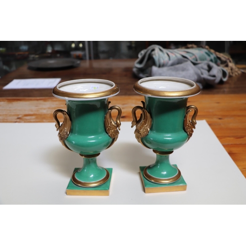 351 - A pair of 19th century continental vases with gilt swan form handles, 25cms high (2).